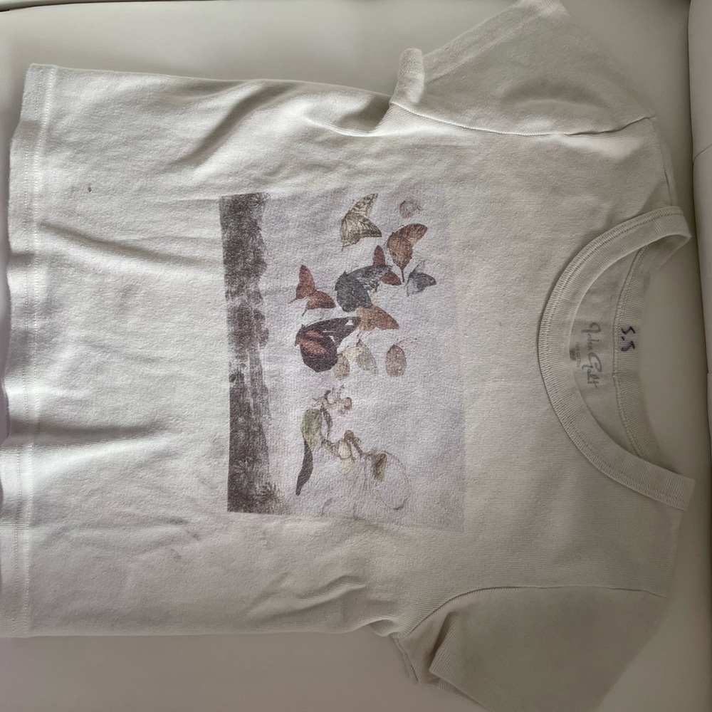 This is a practical and springy top. However there are two stains!
